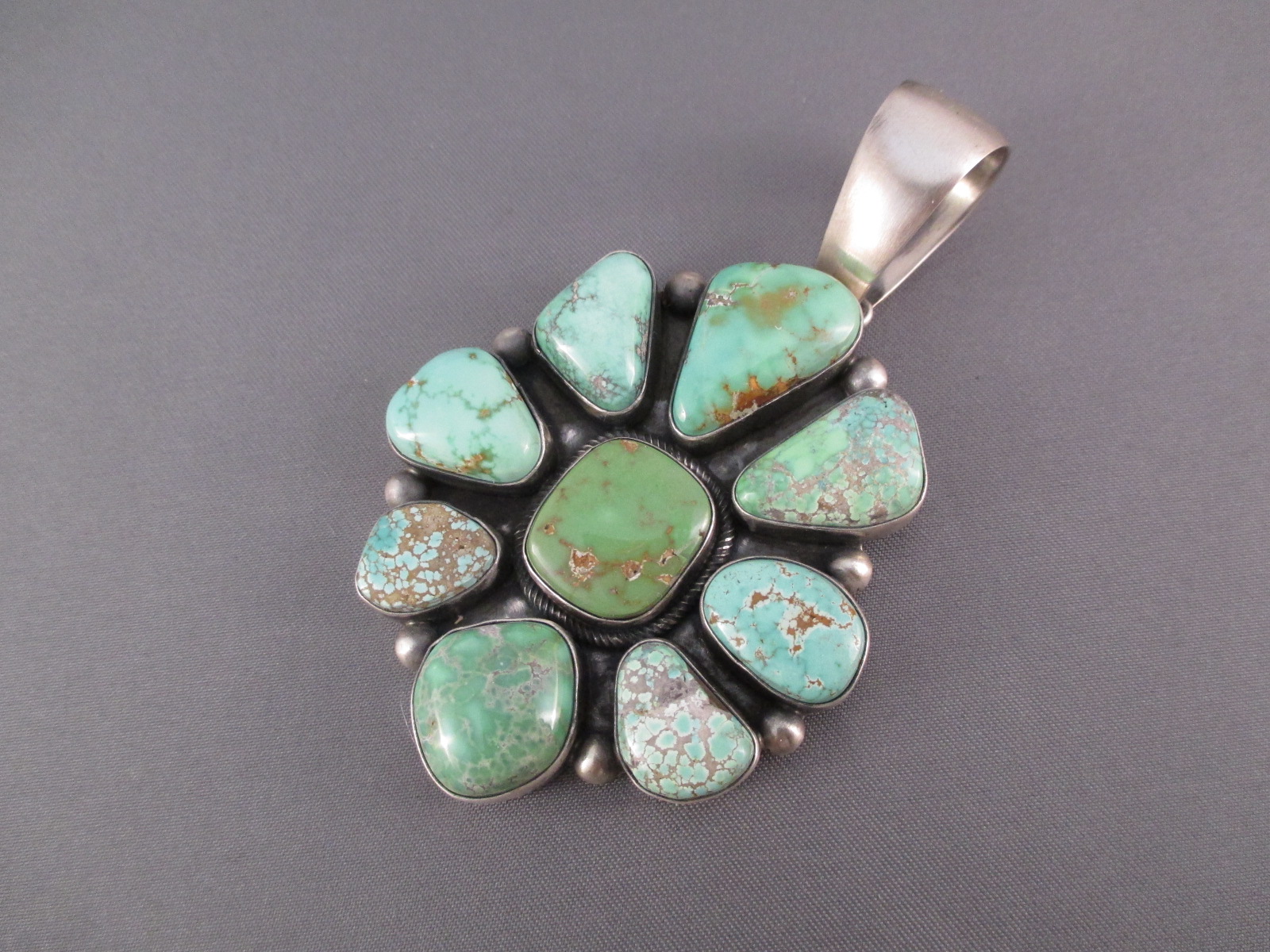 Carico Lake Turquoise Cluster Pendant by Navajo jewelry artist, Paul Livingston $1,450-
