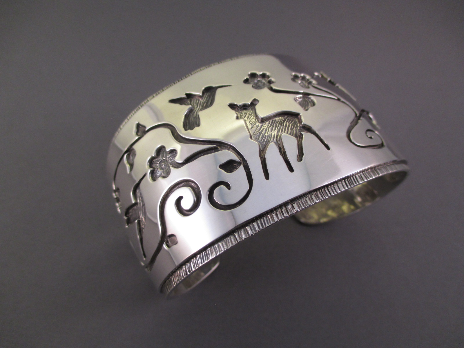 Sterling Silver Cuff Bracelet with flowers, a fawn, and hummingbirds - made by Fortune Huntinghorse