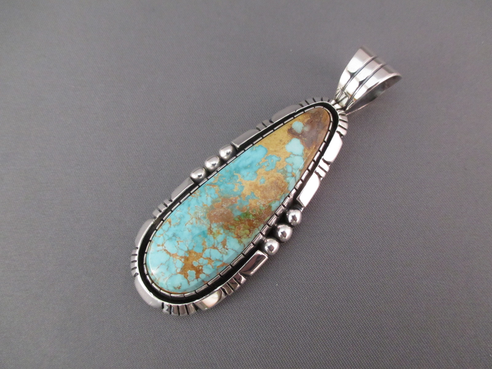 Royston Turquoise Pendant in Sterling Silver by Native American (Navajo) jewelry artist, Delbert Vandever $420-