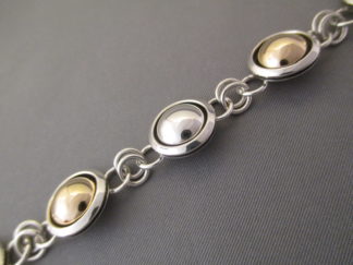 Silver & Gold Bracelet - Sterling Silver & 14kt Gold Link Bracelet by Navajo jewelry artist, Artie Yellowhorse $545-