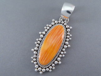 Sterling Silver & Orange Spiny Oyster Shell Pendant by Native American jewelry artist, Artie Yellowhorse $485-