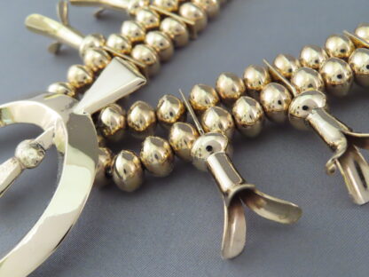 Gold Squash Blossom Necklace by Harrison Jim